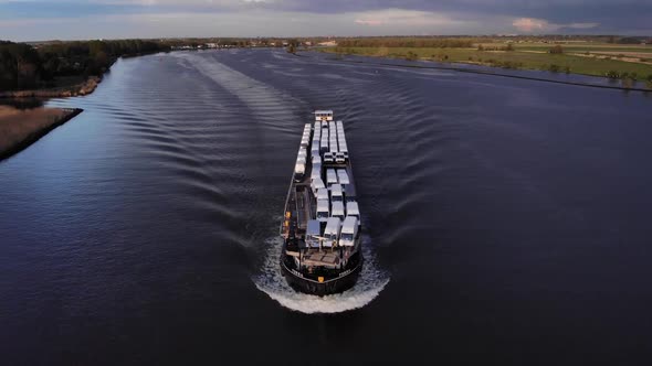 Panoramic View Of Loaded Freighter Of Terra On The River In Barendrecht Town. aerial