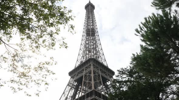 Famous Parisian an French Eiffel tower monument by the day 4K 2160p 30fps UHD video - Beautiful stee