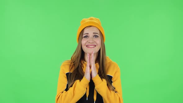 Portrait of Modern Girl in Yellow Hat Is Waiting in Anticipation with Pleasure