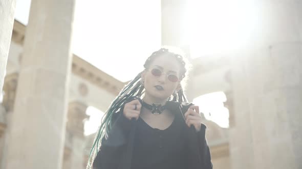 Portrait of Young Goth Woman in Sunlight on Urban City Street