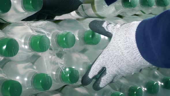Pack Of Water Bottles Is Taken Or Loaded Into Stack