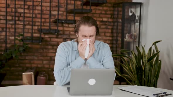 Ill Young Man Sneezing in Handkerchief Blowing Wiping Running Nose