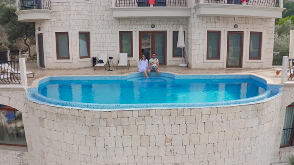 Young Love Fashion Couple Near Swimming Pool at the Luxury Villa on Vacation on Kas Fethiye Turkey