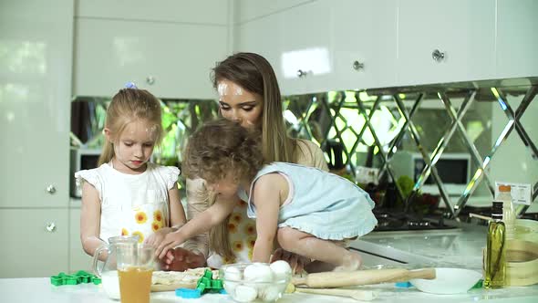 Happy Family Cooking Together At Modern Kitchen