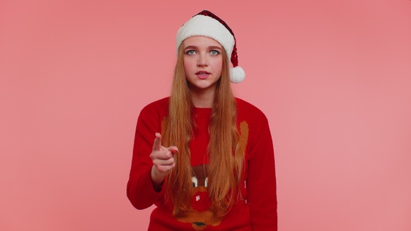 Displeased Girl in Christmas Sweater Gesturing Hands with Displeasure Blaming Scolding for Failure