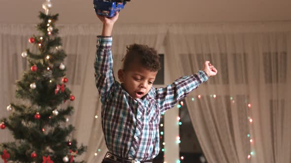 Little Boy Enjoying Christmas Present.