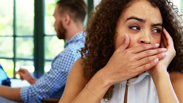 Upset woman sitting in restaurant 4k