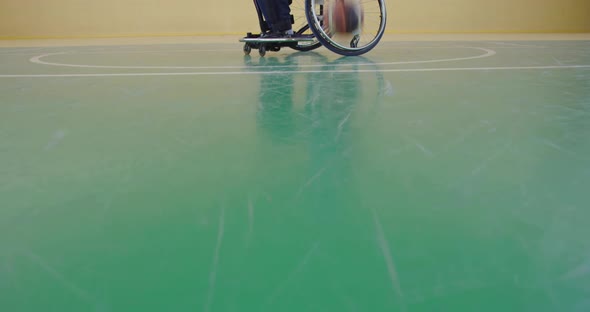 A Person with Disabilities Playing Basketball in the Modern Hall