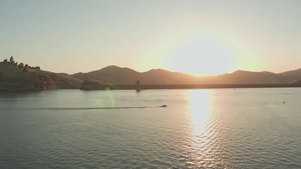 Aerial Drone Tracking Shot of a Boat on a California Mountain Lake Sunset (Lake Kaweah, Visalia, CA)