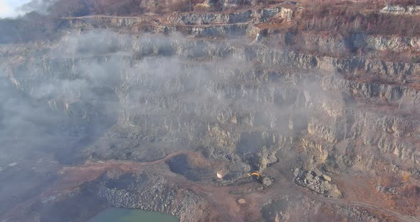 This Area Opencast Mining Quarry with of Machinery at Work of a Morning Fog Over Mountain