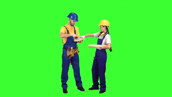 Pair of Builders Choose Wooden Boards. Green Screen