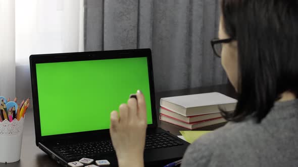 Woman Teacher Making Online Distance Education Video Call on Laptop Green Screen