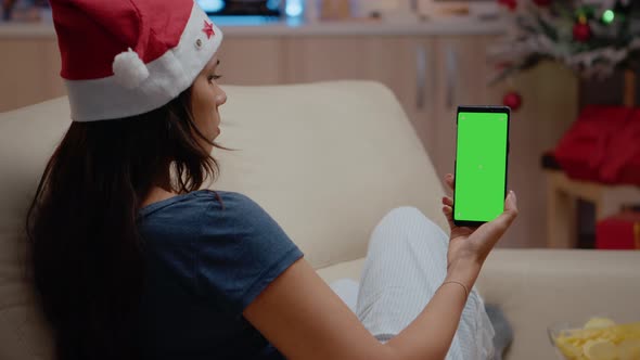 Woman Vertically Holding Smartphone with Green Screen
