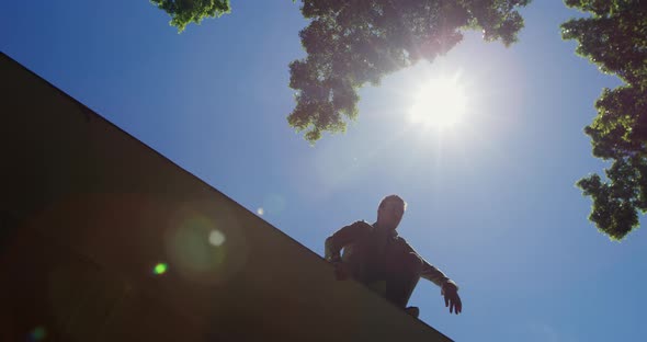 Caucasian man practicing parkour