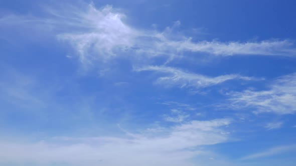 Time lapse of white cloud moving pass around sky background