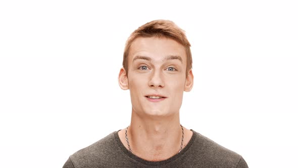 Young Handsome Man Smiling Speaking Over White Background