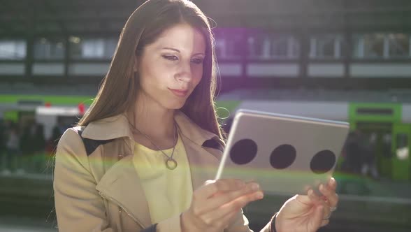 Attractive Young Woman Using Digital Tablet Screen