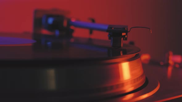 A Vinyl Record Spins in the Gramophone Music Player and Plays an Old Disco