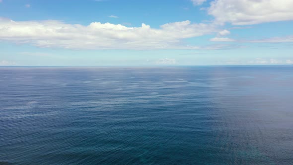 Seascape By Day. Calm Sea and Sky with Clouds.