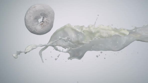 Milk and doughnut in the air, Slow Motion