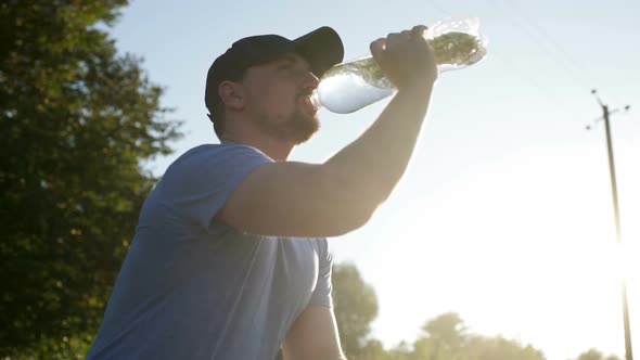 After Training the Athlete Drinking Water. SLOW MOTION.