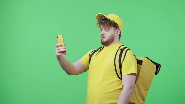 Portrait of Young Men Making Selfie on Mobile Phone Then Looking Photos