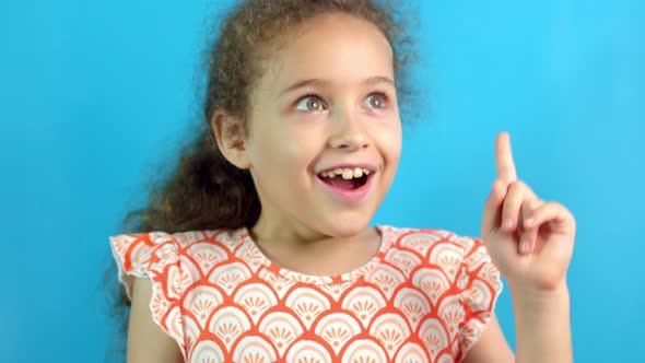 Smiling Happy Little Girl Showing Eureka Gesture