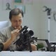 An Asian man is removing a series of camera rigs - VideoHive Item for Sale