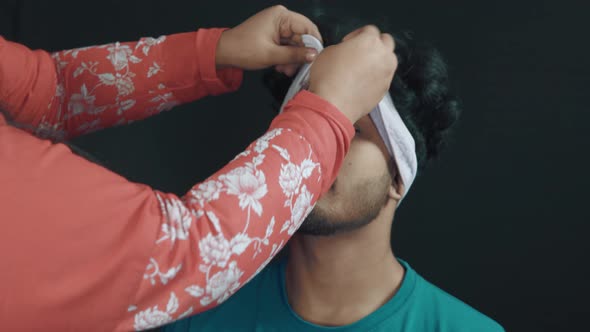 Man in cosmetics studio and make up artist preparing him for cosmetics treatment