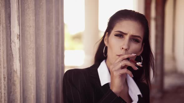 Brunette Model Holds Mouthpiece