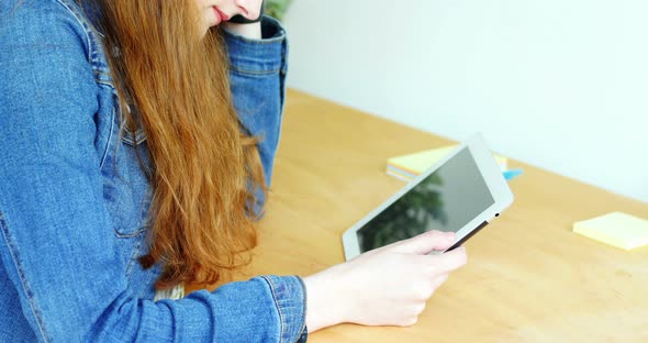 Tense business executive using digital tablet