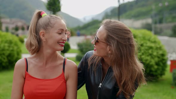 Portrait of Two Girlfriends with Bright Lipstick