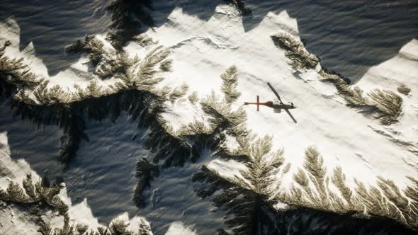 Helicopter Above Mountains in Snow