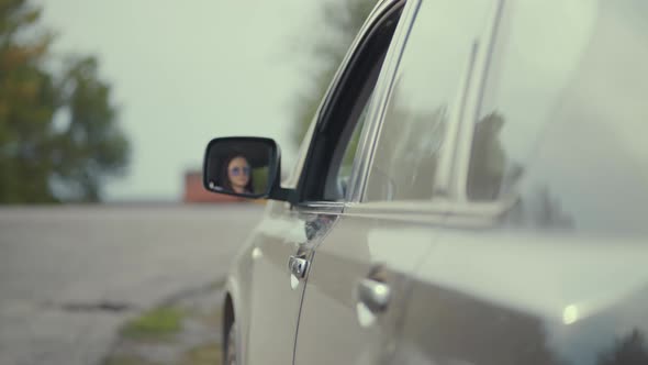 Driver Throwing Away Medical Mask From Car Window on