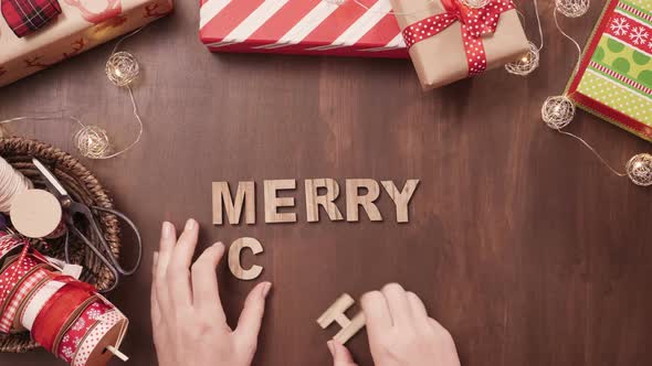 Wood Merry Christmas sign and traditional gingerbread cookies home made.