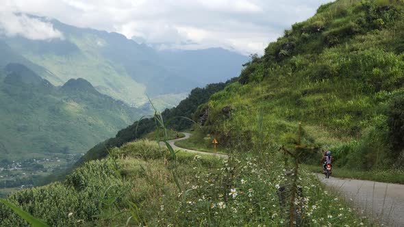 Motorcycles with Young People Are Riding Along the Road In the Mountains Around the Forest A View of