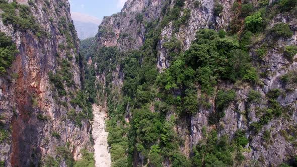 Sand path in between mountains in Albania