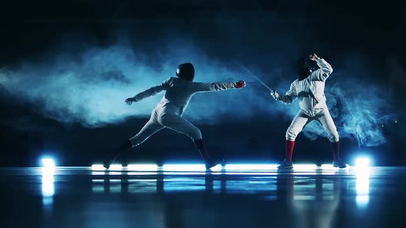 Fencing Practice of Two Competitors in Slow Motion