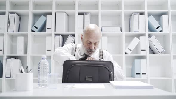 Senior businessman having a sad lonely lunch break