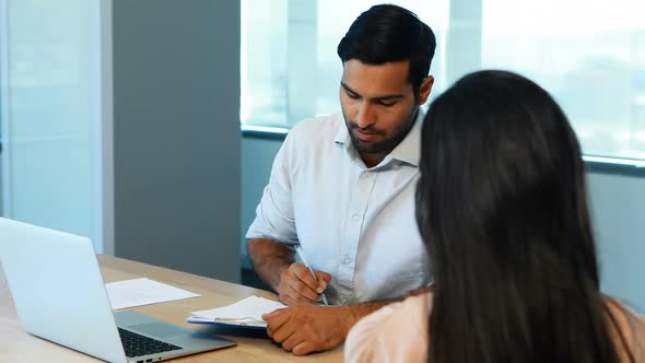 Recruiter taking interview of female candidate