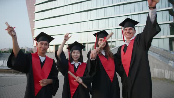 High University Graduates Rejoice at the End of Their Studies People of Different Ages and Races in