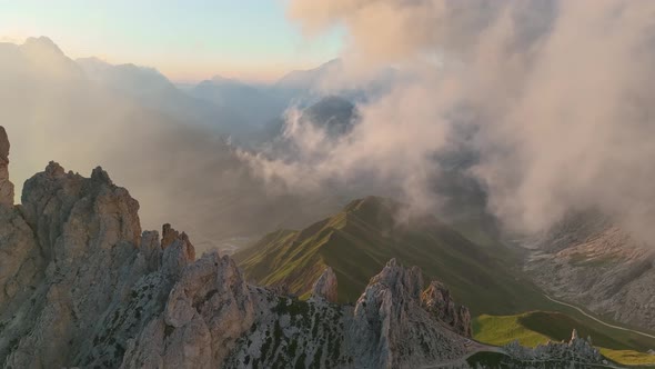 Sunrise in the Dolomites mountains with fog and mist