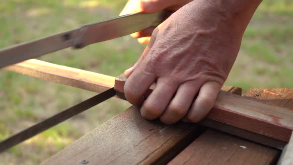 Metal Saw Used In Manual Cutting Of Wood Material. Carpentry Concept. close up