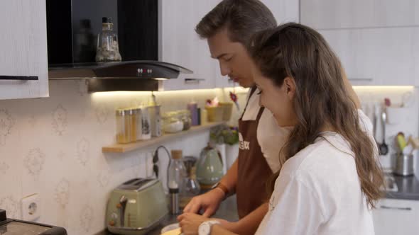 Beautiful Family Couple Enjoy Time Together Cooking Romantic Dinner at Home