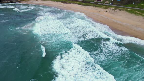 High and powerful waves coming fast to the beach, waves in winter day