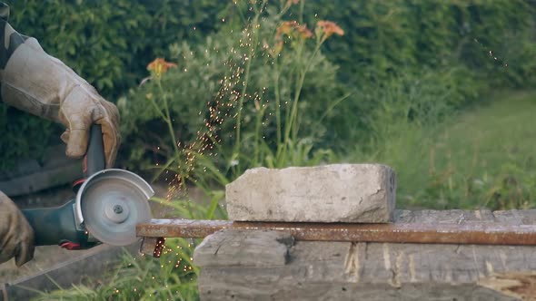 Slow Motion Builder Cuts Part of Metal Detail on Old Table