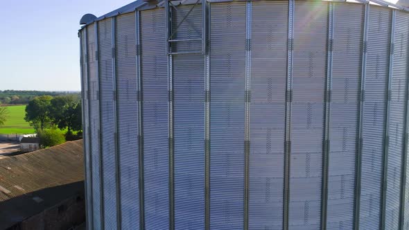 Granary grain elevators. Metal tanks for the storage crop. Large bins for farming.