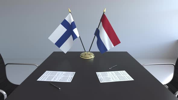 Flags of Finland and Netherlands and Papers