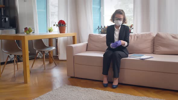 Businesswoman Wearing Protective Mask and Gloves Going for Work