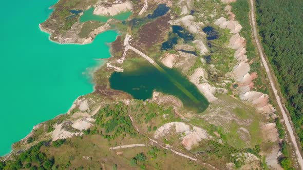 An artificial lake in chalk quarry. view from drone. Turquoise water background